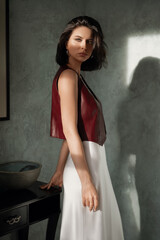 Naklejka premium Fashion photo of beautiful young woman in nice clothes. Fashionable female. Portrait of beautiful woman with nude make-up.