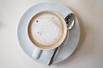 Enjoying a warm cup of coffee in a cozy setting during the afternoon