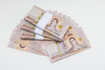 Banknote thai baht, paper bank, price of one thousand, stacked sets isolated on white background. 1000, 500 Bath bank note for shopping, paying bills, taxes, debt, insurance, financial, investment.