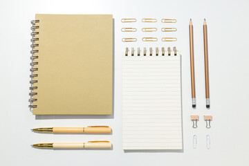 Notebooks with stationery on a white background