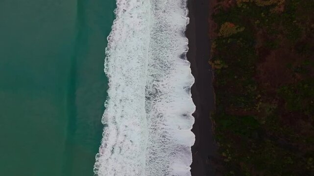 Birdseye view of USAL Beach Campground waves black sand Whitehorn Northern California aerial drone fog mist rain clouds Lost Coast Trail Redwood National State Park Forest PNW coastline static