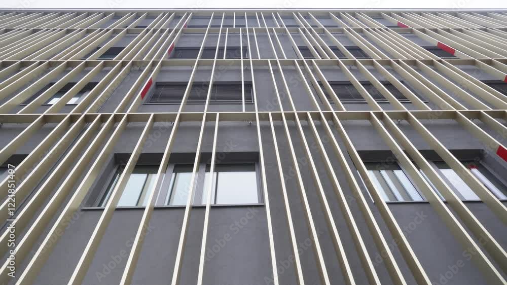 Poster slow establishing shot of vertical architecture running up a building