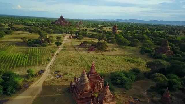 A breathtaking aerial view of a sunset illuminating the temple pagodas in Bagan, Myanmar. Captures the serene beauty and cultural heritage of this ancient sacred site.