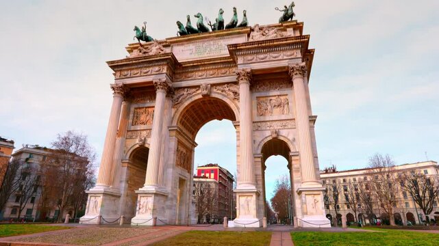 Scenic perspective of the iconic Arco della Pace in Milan, surrounded by a tranquil urban setting during winter