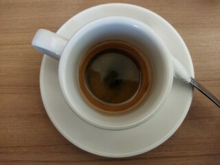 cup of esspresso coffee top up view 