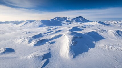Majestic Antarctic mountains, expansive frozen seascape, pure white snow fields, jagged ice formations, bright polar day, aerial drone shot, arctic atmosphere, tranquil winter scene, natural light,