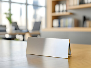 metallic nameplate sits on executive desk in modern office, reflecting light and creating professional atmosphere