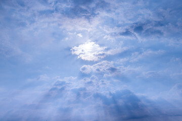 view of blue sky with shining sun. White fluffy clouds on a blue sky. spring season.