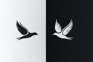 Two stylized birds in flight contrasting black and white