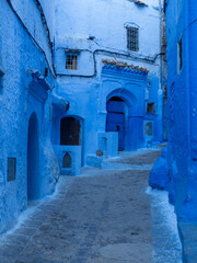 Chefchaouen,  the blue city in Morocco - A narrow street with interesting doors and windows.