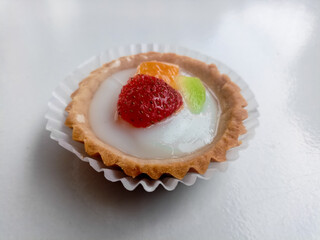 Small fruit pia cake on a white background. Kue Pia Buah.