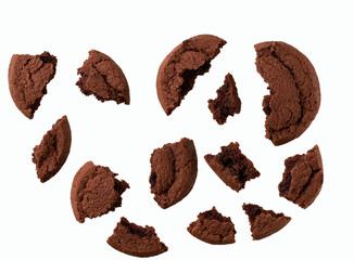 Broken chocolate cookies isolated on white background, top view.