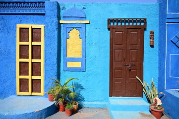 blue door. Indian archtecture. blue stone walll. 