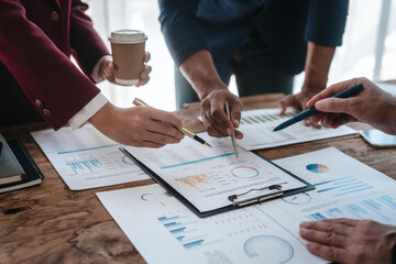 A close-up of a businessman explaining finance, business planning, and marketing during a meeting at the table,demonstrating teamwork and collaboration to achieve strategic goals successful outcomes