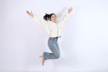 Woman Jumps with Joy, Expressing Happiness and Excitement on White Background