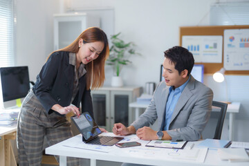 Business professionals collaborating on digital presentation