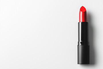 Obraz premium Red lipstick in a black tube, white background, empty space for text.