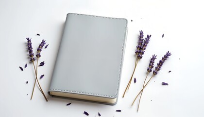 Gray notebook and lavender sprigs on a white background.  A calming, minimalist aesthetic.