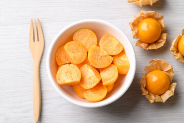 Fresh Cape gooseberry or Golden berry (Physalis peruviana) in bowl ready to eating, Healthy fruit, Top view
