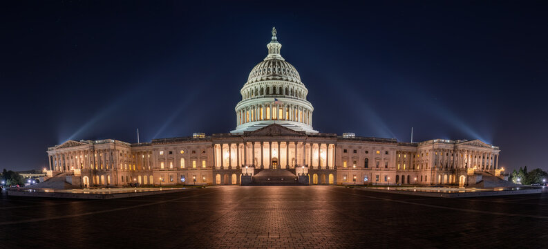 Panorama of the illuminated U.S. Capitol Building in Washington D.C. at night