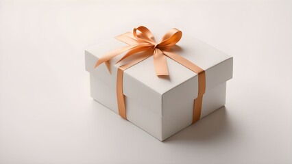 Obraz premium Elegant white gift box with a delicate peach ribbon bow.