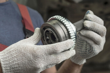 A joint of equal angular velocities.CV joint.In the hands of an auto mechanic is a part of the...