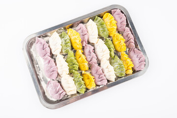 Chinese New Year food: a box of colorful dumplings