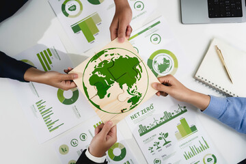 Green business corporate put jigsaw together for sustainable environment development goal. Group of volunteers help solve environmental problem together to net zero. World environment day, ESG concept