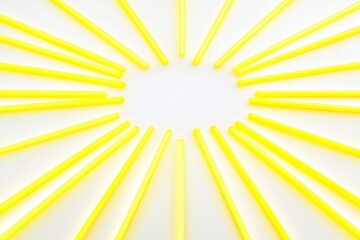 Fototapeta premium Radiant Yellow Straws Arranged in Circular Pattern on White Surface