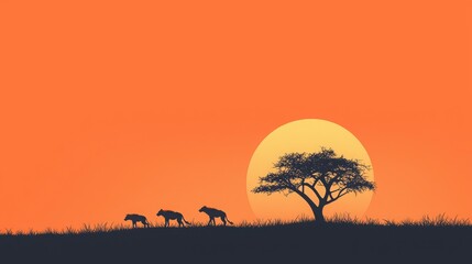 Silhouette of animals walking under a sunset with a lone tree.