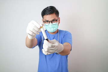 doctor in mask research a medical test glass with blood isolated on white background