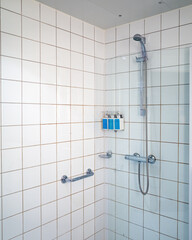 shower head in bathroom and glass walk-in shower in a bathroom