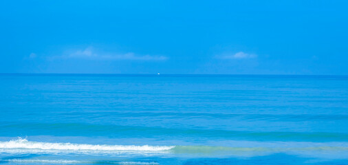 The summer vacation background with Nature on the beach and sea  blue water  summer with sunlight, sandy beach