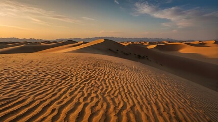 Sunset in a desert with wave of sand