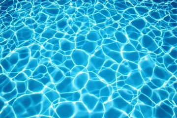 Obraz premium Abstract view of sunlight refracting on a bright blue water surface, forming rippling patterns.