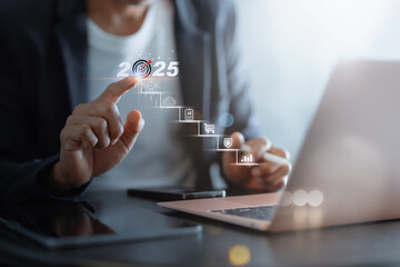 2025 New Year Business Goals Concept. Businessmen point to "2025" on a staircase, steps toward achieving business goals, growth, and success in the new year. Planning and challenge, investors target,