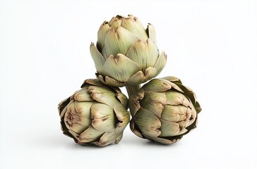 Obraz premium Pile of three artichokes isolated on a white background