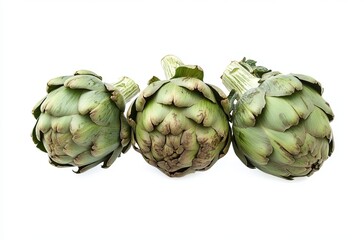 Obraz premium Pile of three artichokes isolated on a white background