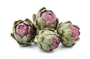 Obraz premium Pile of three artichokes isolated on a white background