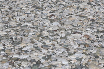 river bed pebbles at river side