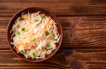 Tasty marinated cabbage with carrot, healthy food  Sauerkraut photography . Top view