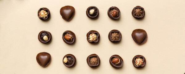 Different kinds of chocolates on colored table close-up. Top View and Flat Lay