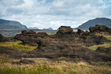 A stunning mountain landscape with unique lava rock formations along Route 1 near Vik in South Iceland, showcasing the region's dramatic natural beauty
