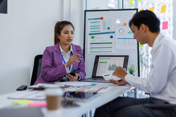 Team of Business brainstorming planning analyzing the financial report, Marketing plan researching. Paperwork on the table, laptop computer.Brainstorming Group of people Working Concept.	