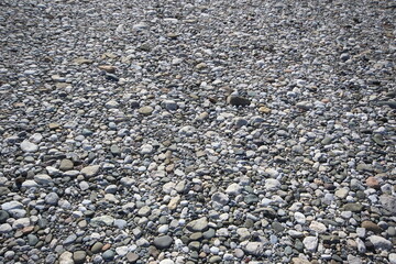 river bed pebbles at river side