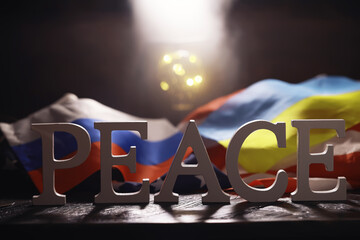 Peace Word Written In Wooden Letters. International conflict, American hegemony, War. Ukraine and...