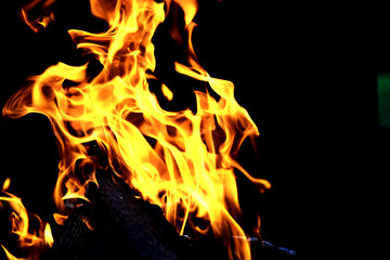 Background of the flame in the oven. Tongues of fire in a fireplace. Fire texture.