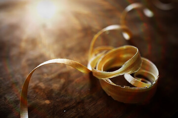 Hand planer with wooden sawdust. On a wooden background. High quality photo
