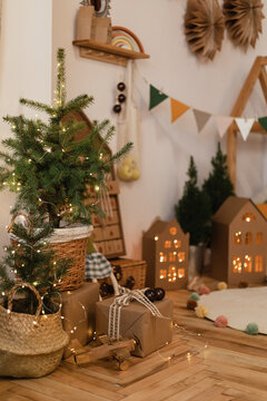 Illuminated Christmas tree decoration with string lights at home