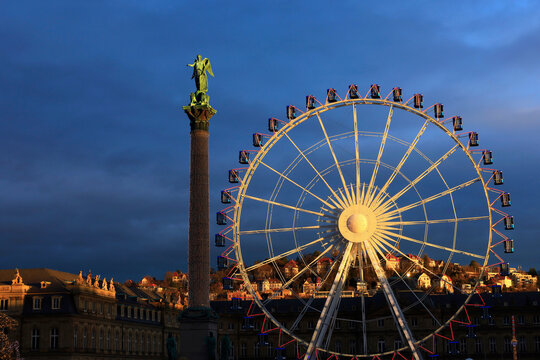 Schlossplatz Stuttgart with Jubil�umss�ule and ferris wheel during Christmas time